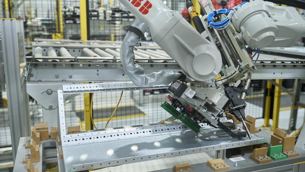 WD Mar 24 - ABB Robotics Facility press release - Robot Assembling Controller Cabinet Component.jpg